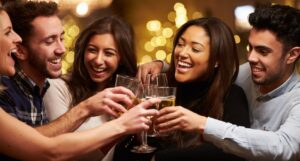 Group Of Friends Enjoying Evening Drinks In Bar